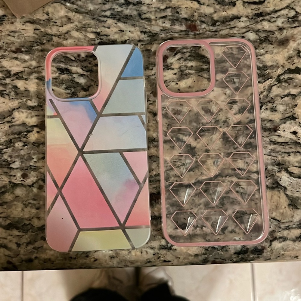 Two 14 pro max phone cases